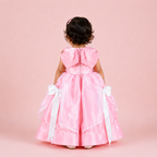 Pink floor-length gown for girls with white satin bow accents and layered organza skirt — Fairy Frills handcrafted princess dress