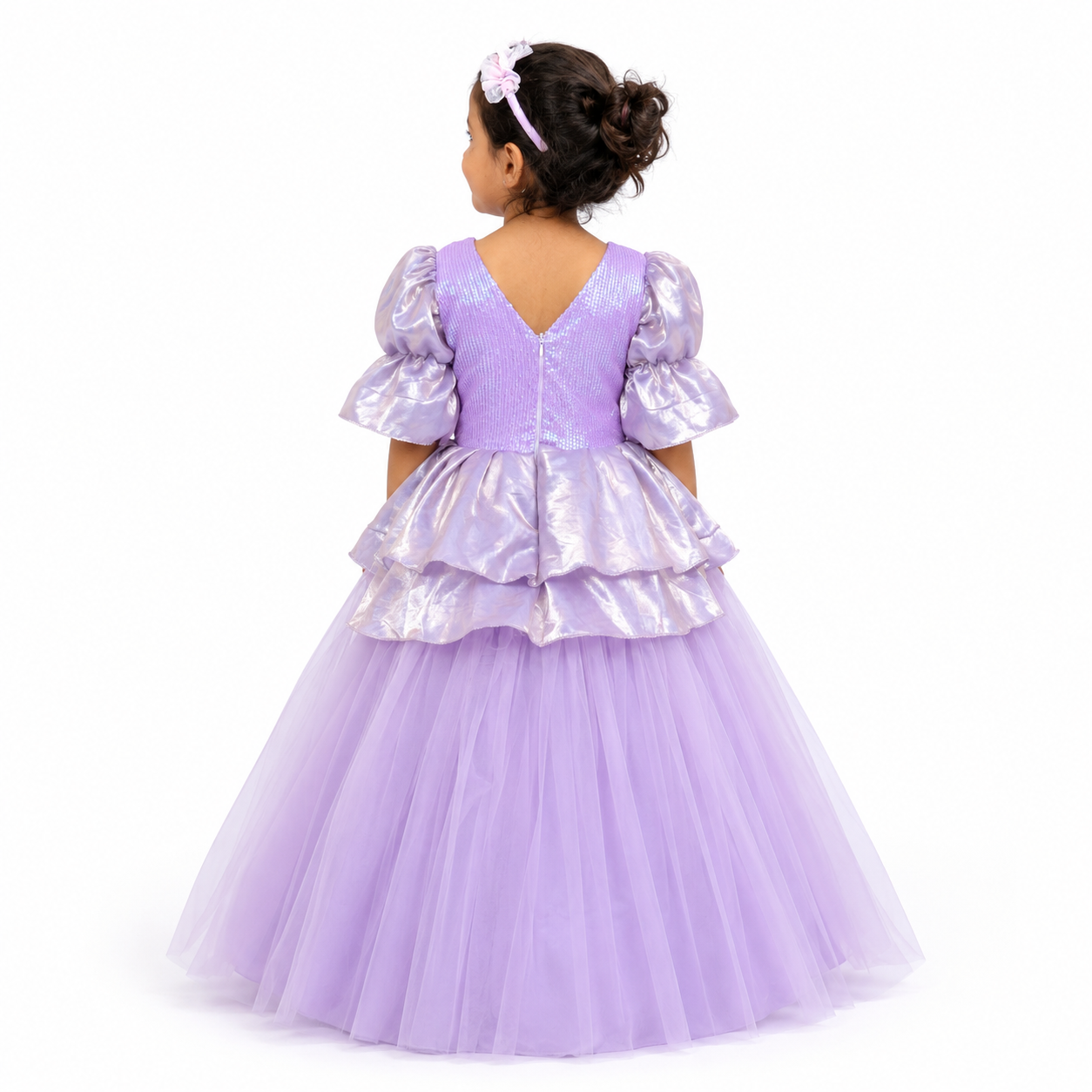 Child wearing a purple princess dress with puffed sleeves.